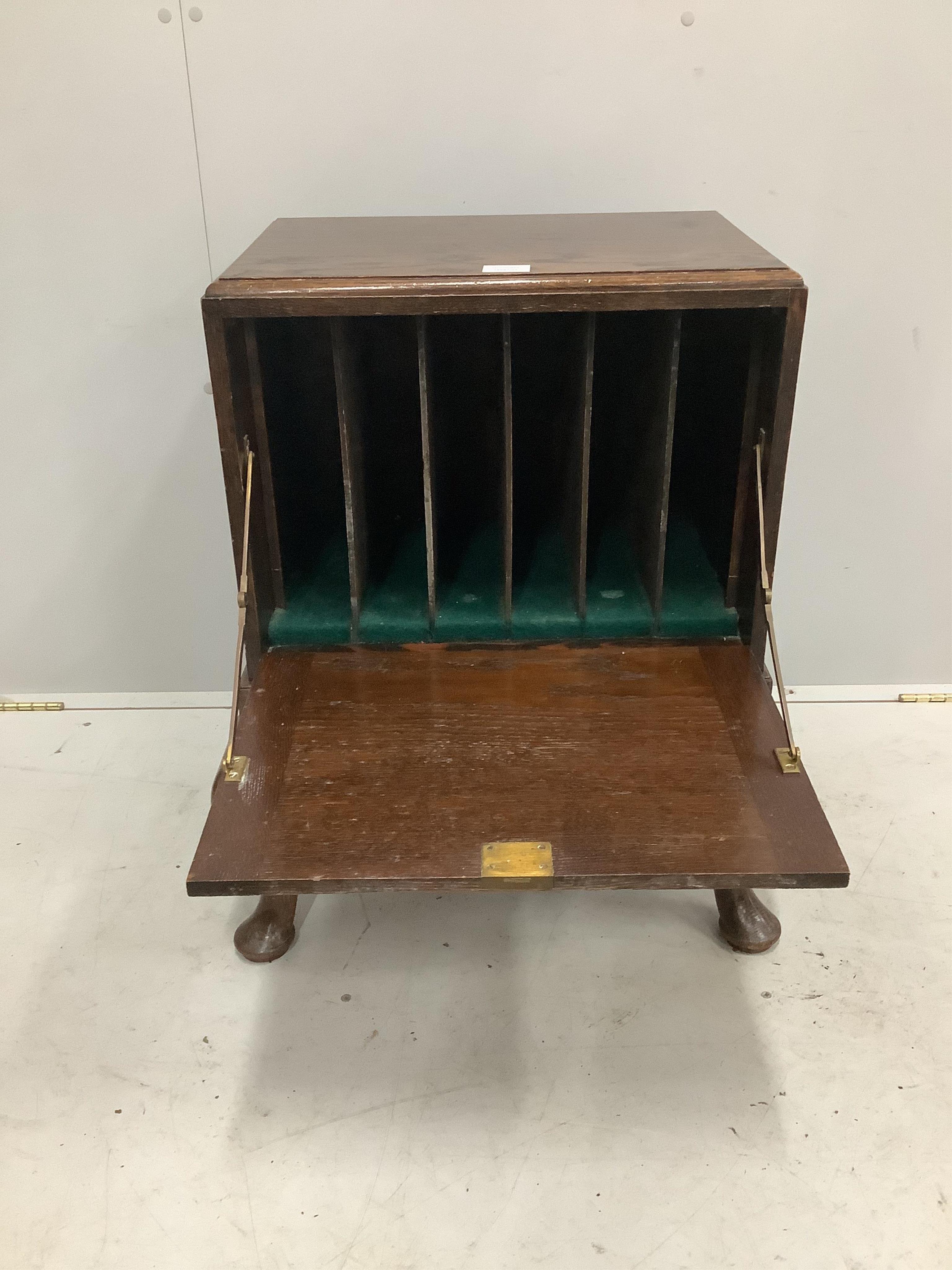 An early 20th century George II style oak record cabinet on cabriole legs, width 59cm, depth 45cm, height 71cm. Condition - fair